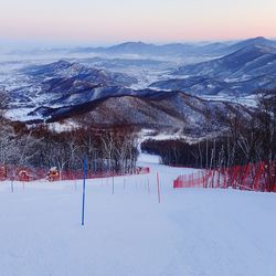 Scenic view of mountains against sky during winter