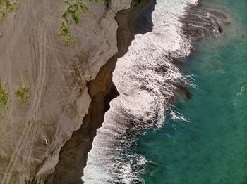 High angle view of rock formation in sea