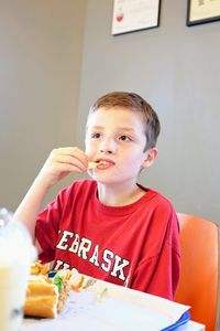 Portrait of boy eating food