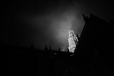 Low angle view of silhouette of building against sky