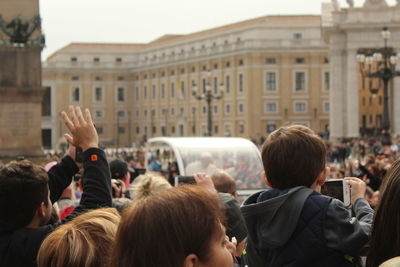 Group of people photographing the pope in the vatican