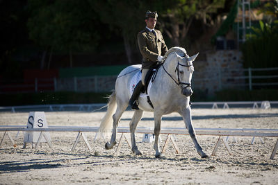 Full length of man riding horse