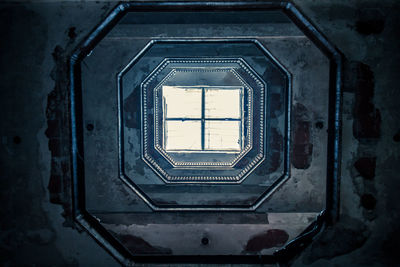 Directly below shot of spiral staircase of building