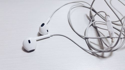 High angle view of headphones on white table