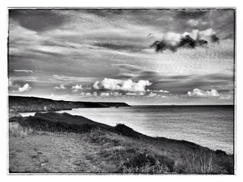 Scenic view of sea against cloudy sky