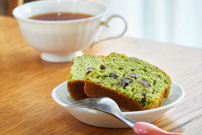 Close-up of dessert and tea served on table