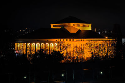 Low angle view of illuminated building at night