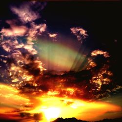 Low angle view of dramatic sky during sunset