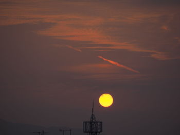 Low angle view of silhouette building against sky during sunset