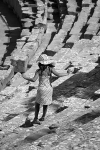 Full length of woman standing by railing