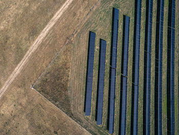 High angle view of metal grate on road