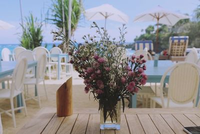 Close-up of flower vase on table in balcony