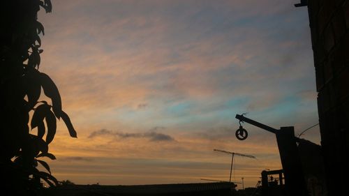 Low angle view of cloudy sky at sunset