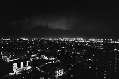 Crowd against sky at night