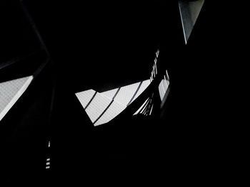 Close-up of flags against black background