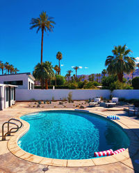 View of swimming pool against blue sky