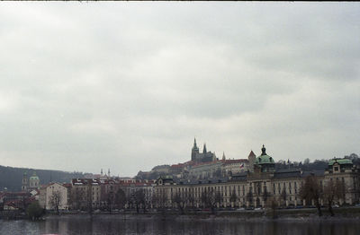 River in city against sky