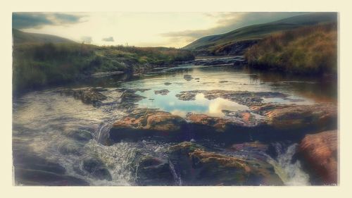 Scenic view of river against sky