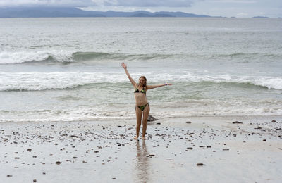 Woman standing on beach