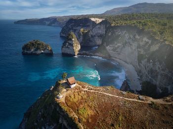 High angle view of rocks in sea against sky