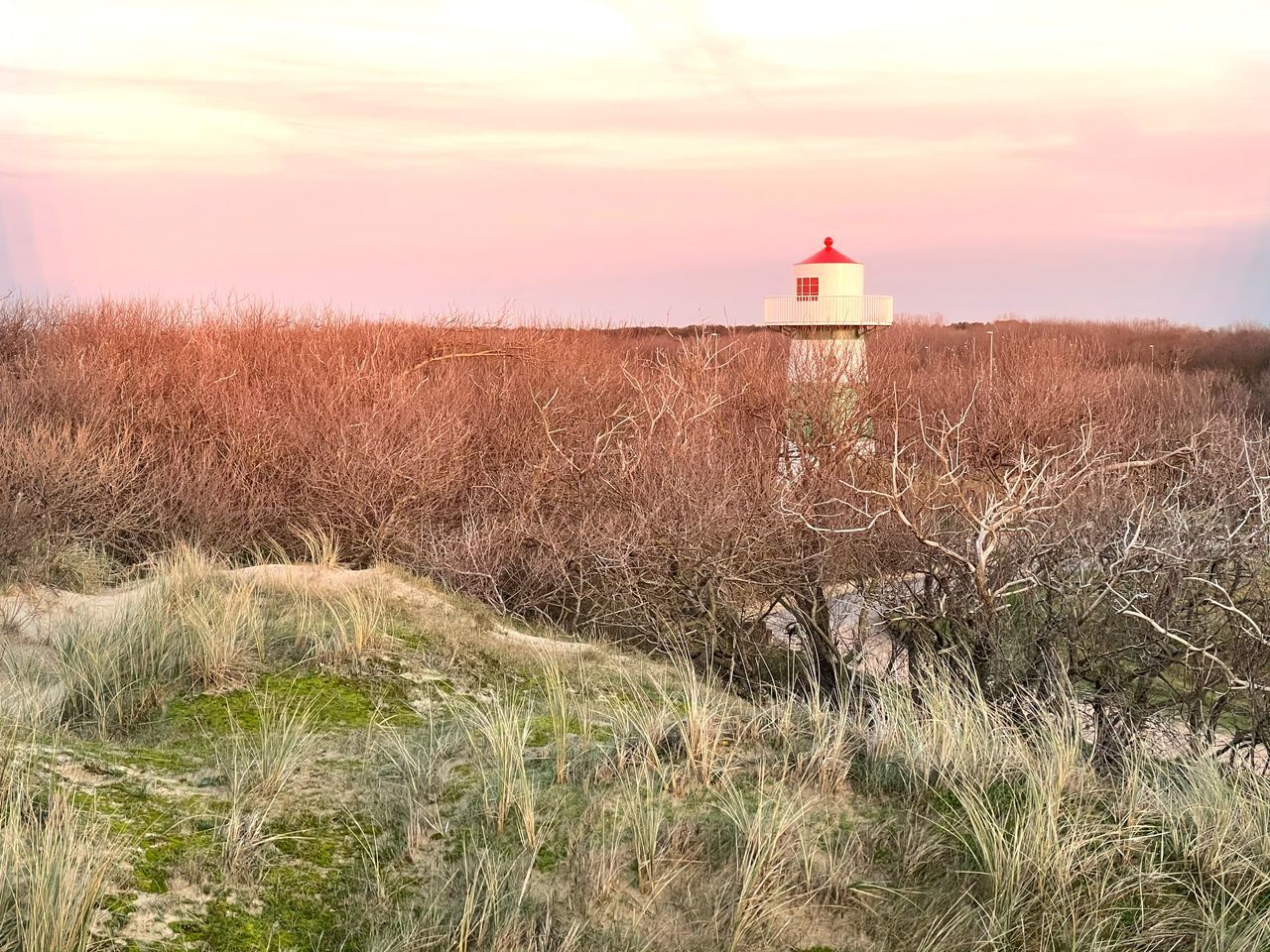 LIGHTHOUSE ON LAND AGAINST SKY AT SUNSET