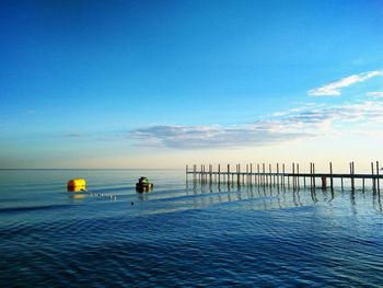 Scenic view of sea against blue sky