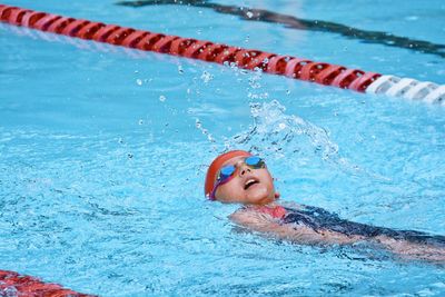 High angle portrait of man swimming in pool