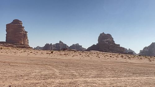 Panoramic view of rock formations against sky