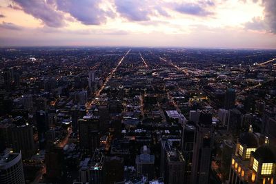 Untouchable - chicago - aerial view of illuminated city against sky during sunset