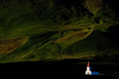 View of church against mountain at night