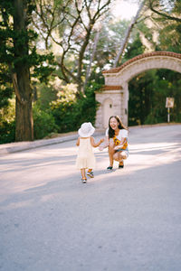 Rear view of woman walking in park