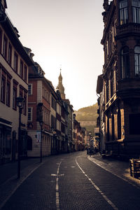 Street amidst buildings in city against sky