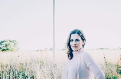 Young woman standing on field