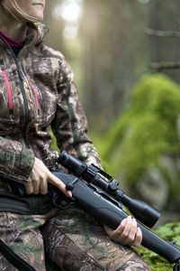 Woman hunting in forest