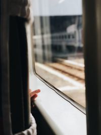 Man seen through train window