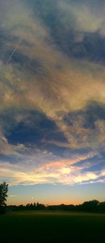 Scenic view of landscape against cloudy sky