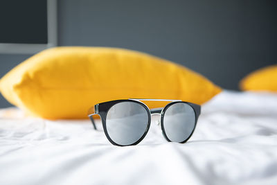 Close-up of sunglasses on glass