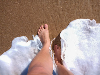 Low section of people on beach