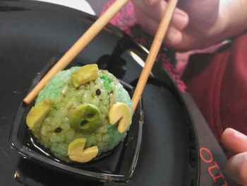 Close-up of hand holding ice cream