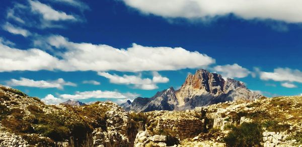 Scenic view of mountains against cloudy sky