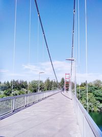 Empty road with bridge in background