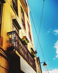 Low angle view of building against blue sky