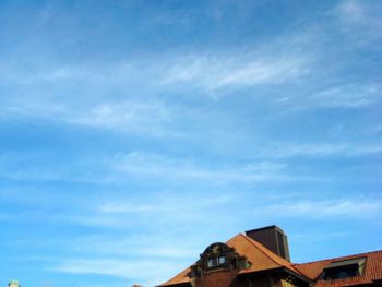 High section of building against blue sky