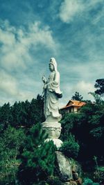 Low angle view of statue against sky