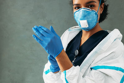 Young doctor wearing flu mask at hospital