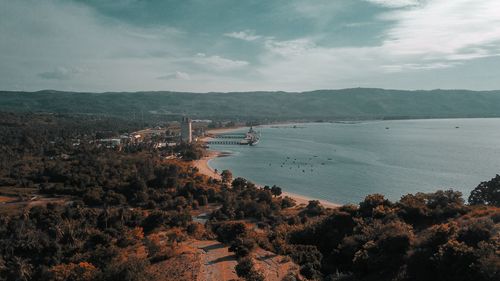 Bridge over sea against sky