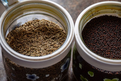 High angle view of coffee beans in jar on table