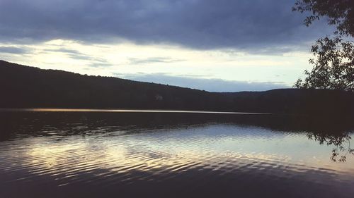 Scenic view of lake against sky during sunset