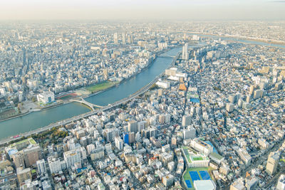 High angle view of crowd in city against buildings