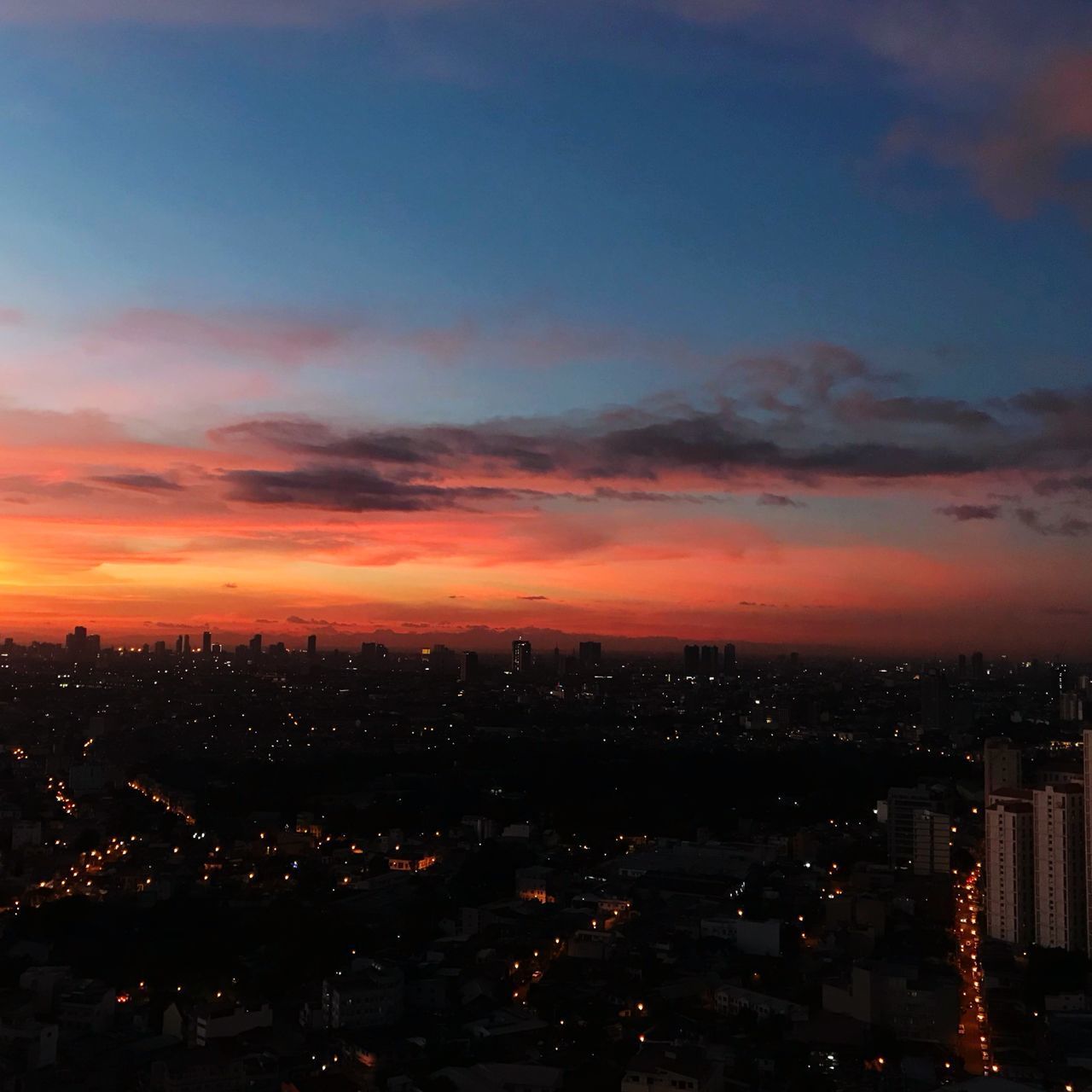 AERIAL VIEW OF ILLUMINATED CITY